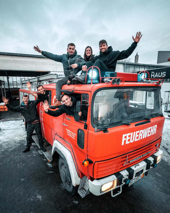 group of people in old firetruck